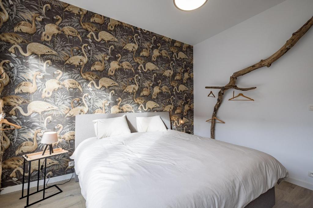 Postel nebo postele na pokoji v ubytování Gîtes in Huy - Appartements chaleureux dans le centre de Huy