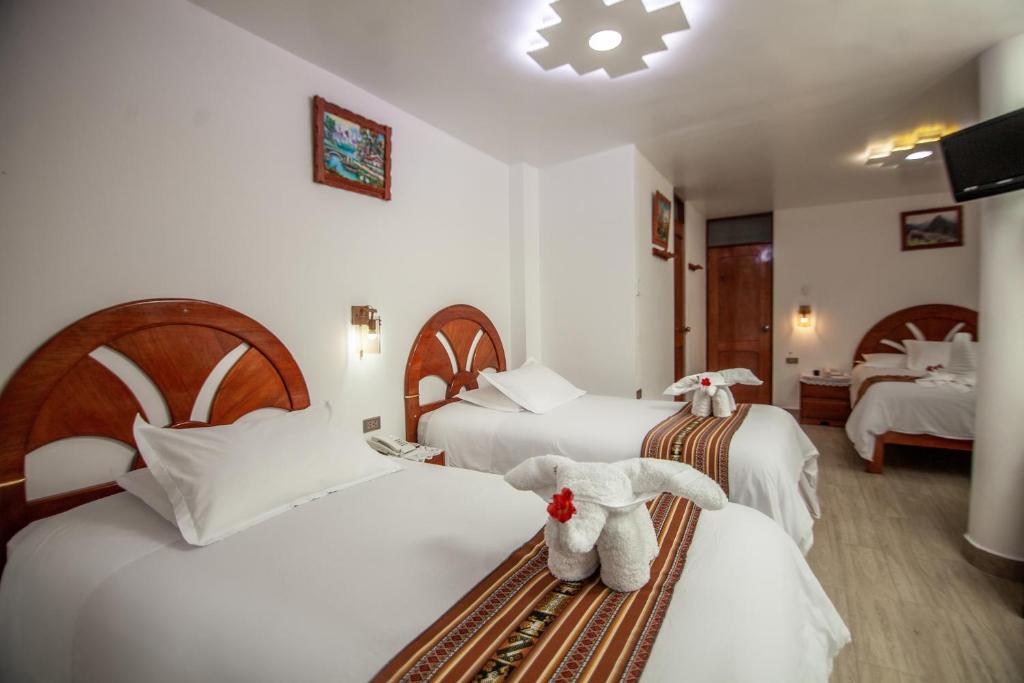 Postel nebo postele na pokoji v ubytování MAPILAND- Hotel Boutique