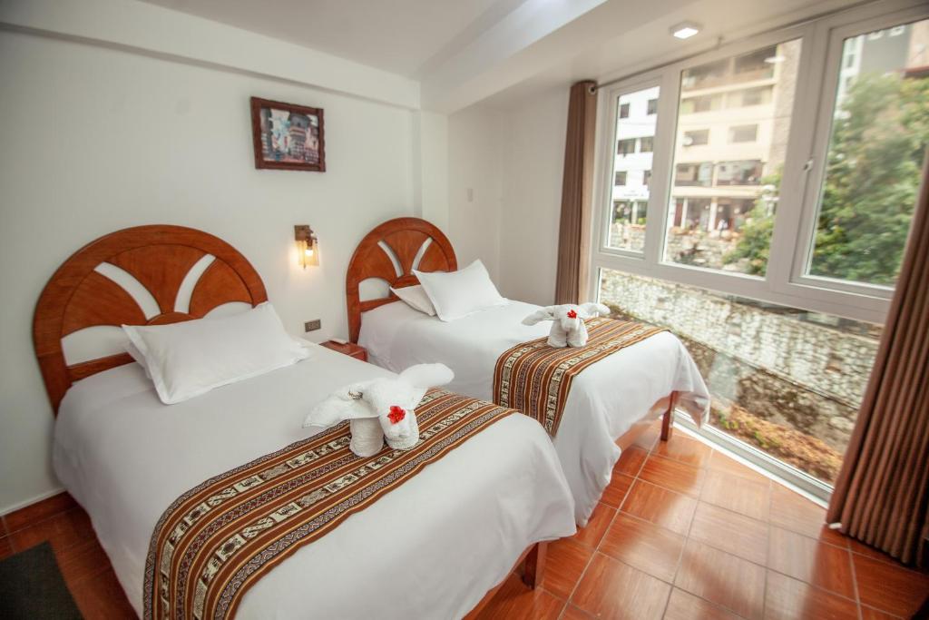 Postel nebo postele na pokoji v ubytování MAPILAND- Hotel Boutique