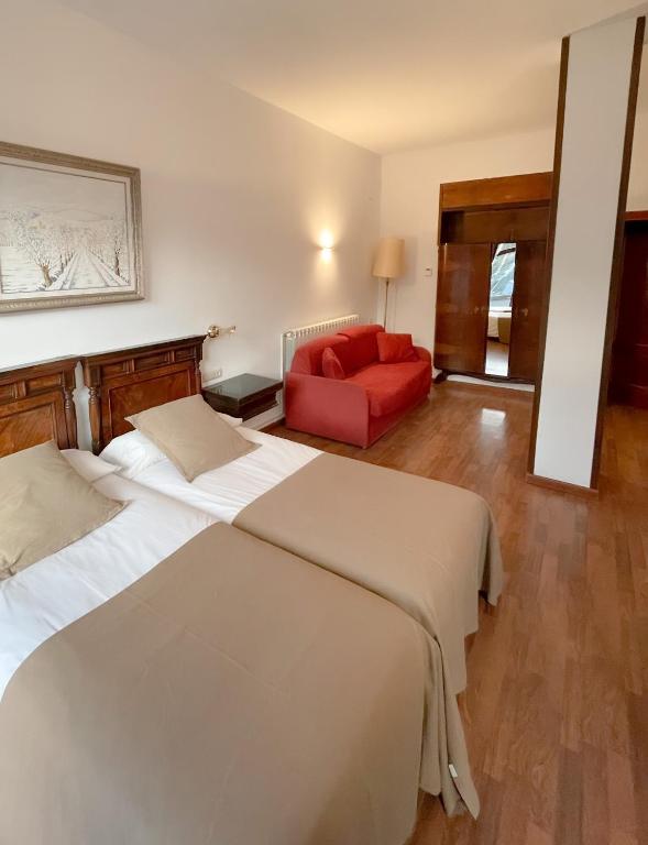 Postel nebo postele na pokoji v ubytování Hotel Amoretes