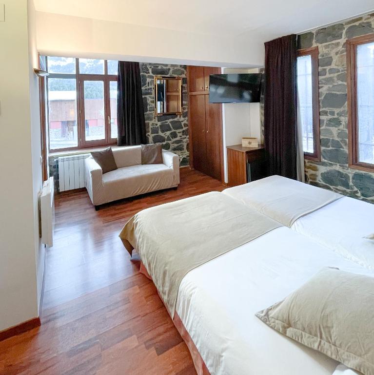 Postel nebo postele na pokoji v ubytování Hotel Amoretes