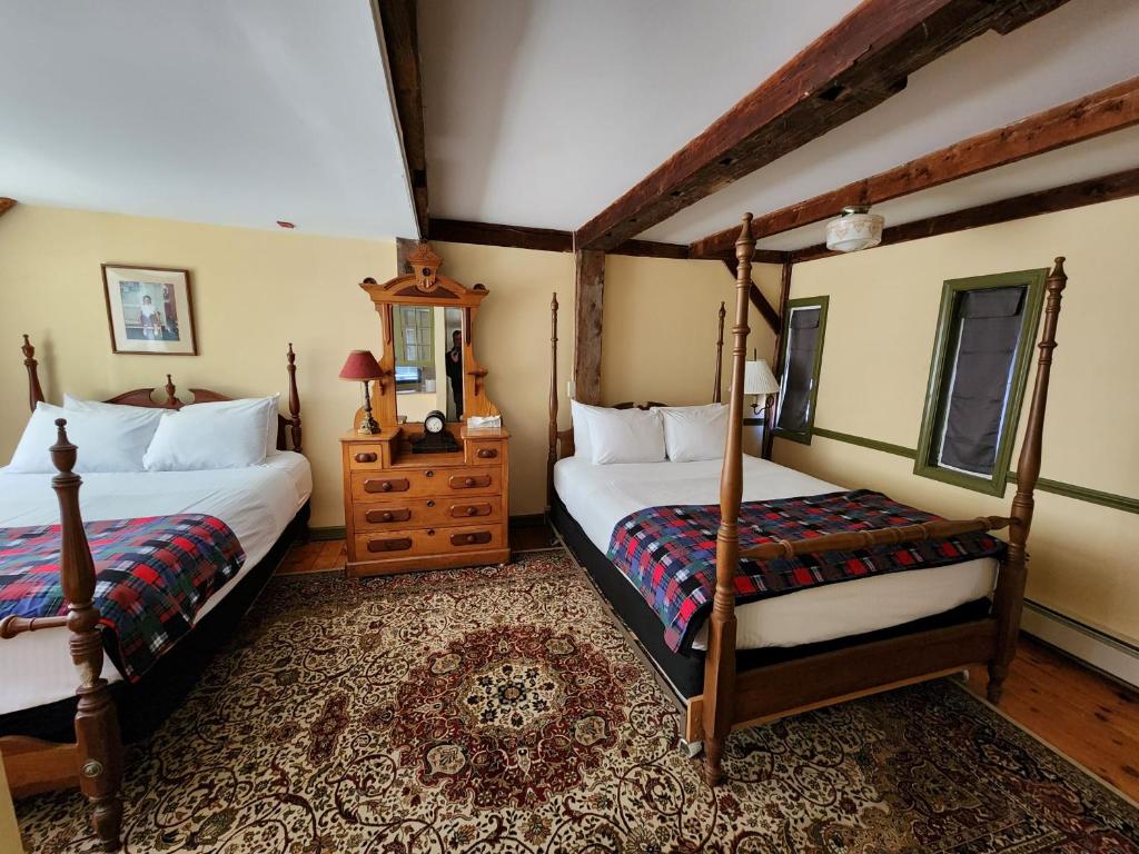 En eller flere senge i et værelse på Arlington Inn & Spa
