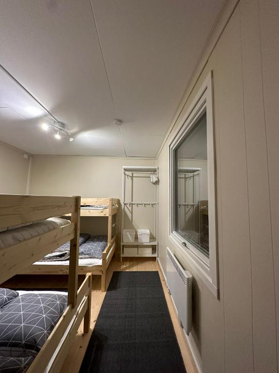 Postel nebo postele na pokoji v ubytování Camp Caroli Family House