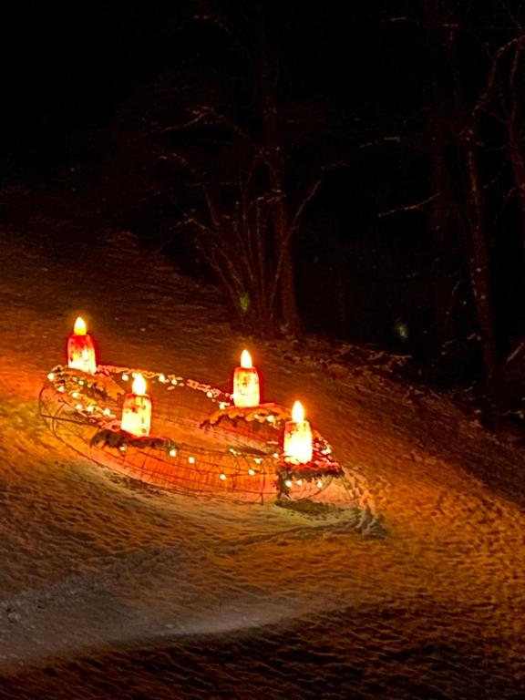 a small boat with lights in the sand at night at groassehof Haus Gstrein in Imsterberg