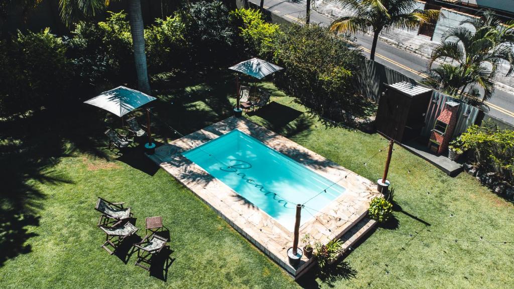 an overhead view of a swimming pool in the grass at Bacana Hotel Boutique in Búzios