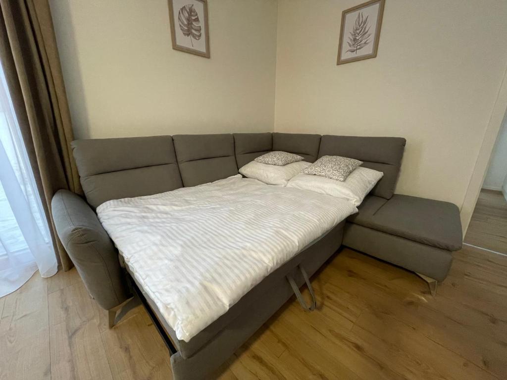 A bed or beds in a room at Apartmán Holia, Kubínska Hoľa
