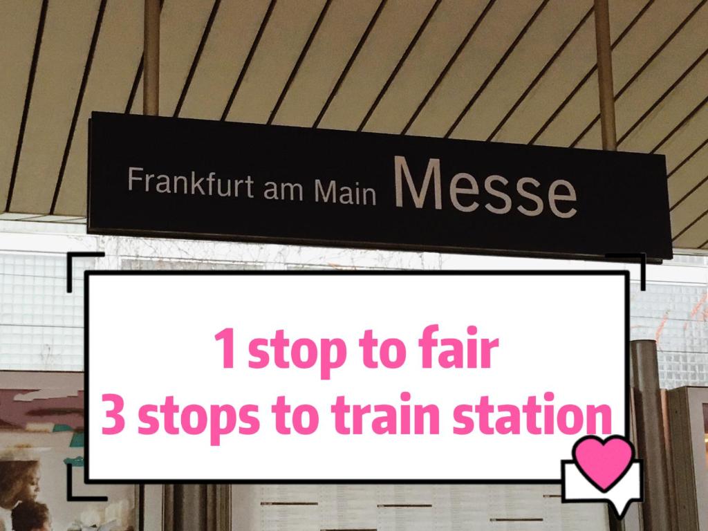 a sign that says i stop to fair stops to train station at Fair and City Frankfurt,85square in Frankfurt