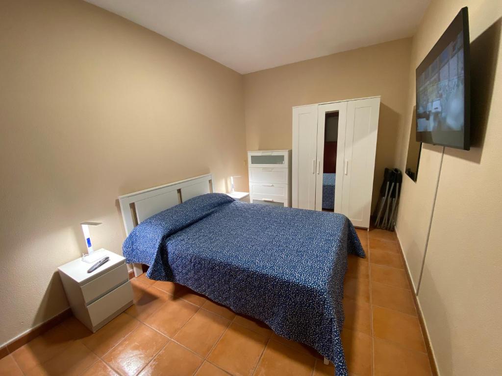 Postel nebo postele na pokoji v ubytování Villa Mogan Mall, con jacuzzi y PlayStation 5
