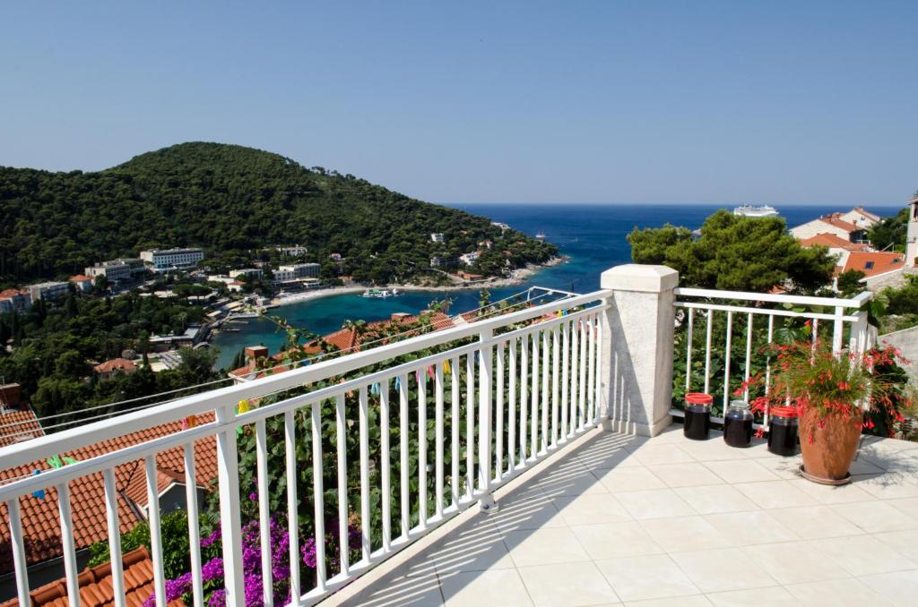 a balcony with a view of the ocean at Studios Maslac in Dubrovnik