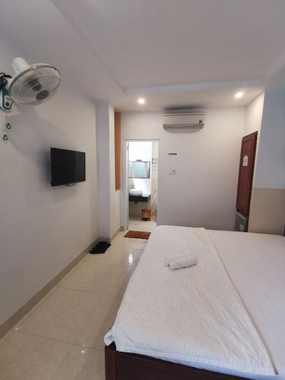 Postel nebo postele na pokoji v ubytování Sen Vàng Hotel