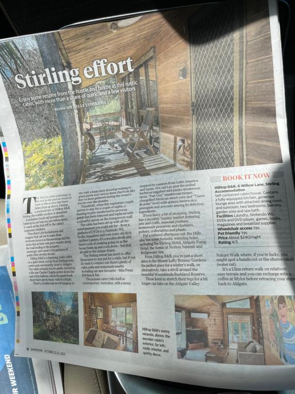 een krant met een foto van een woonkamer bij Hilltop in Stirling