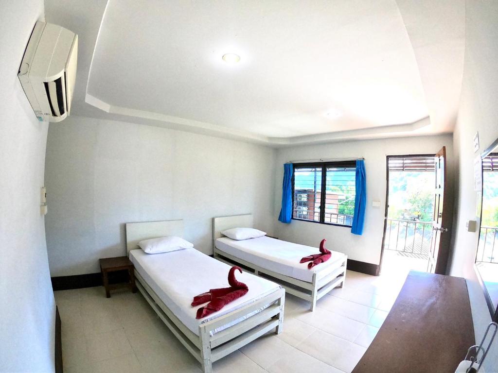 Postel nebo postele na pokoji v ubytování JR GYM & Resort