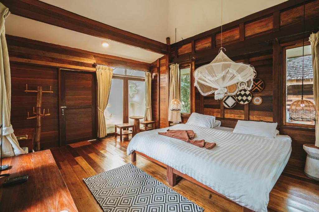 Postel nebo postele na pokoji v ubytování Koh Kood Resort