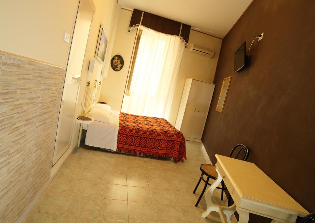 Letto o letti in una camera di Hotel Giugiù