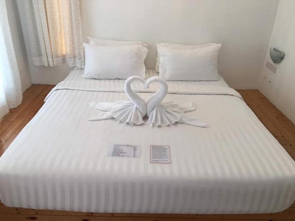 Кровать или кровати в номере White house bailan resort