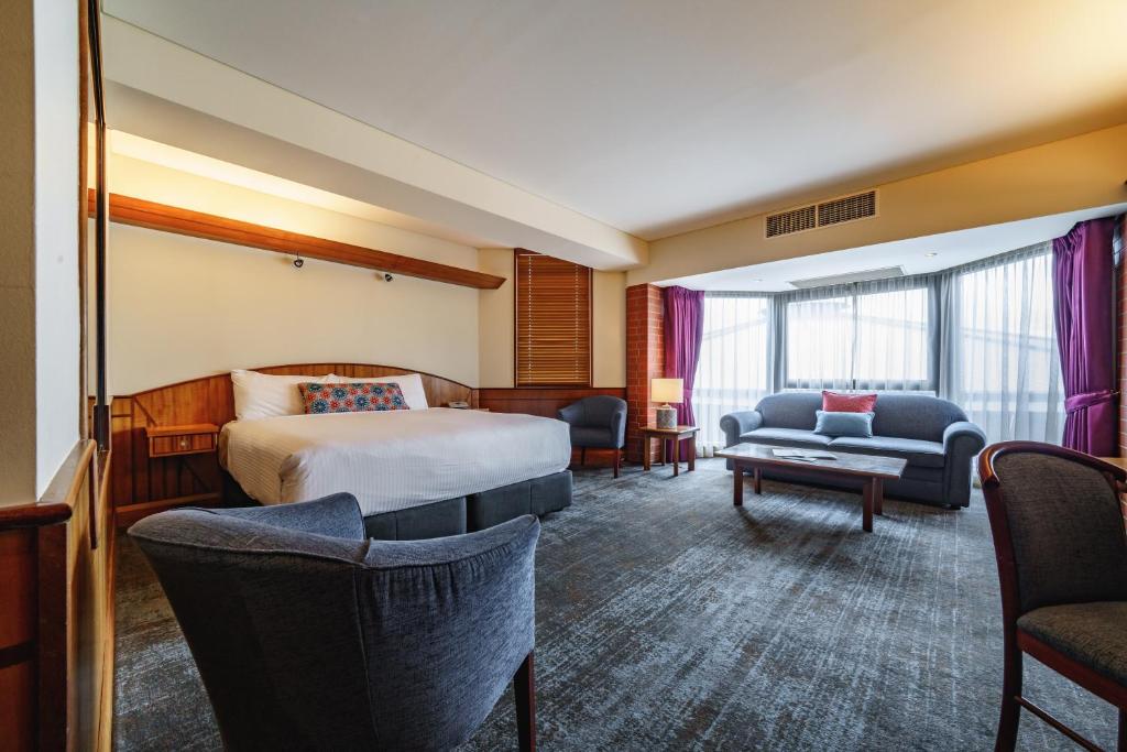 Postel nebo postele na pokoji v ubytování Arkaba Hotel
