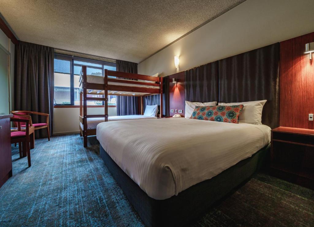 Postel nebo postele na pokoji v ubytování Arkaba Hotel