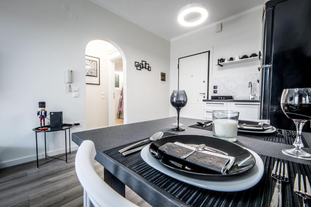 a table with a plate of food on top of it at Escape Luxury Apartment in Nafplio