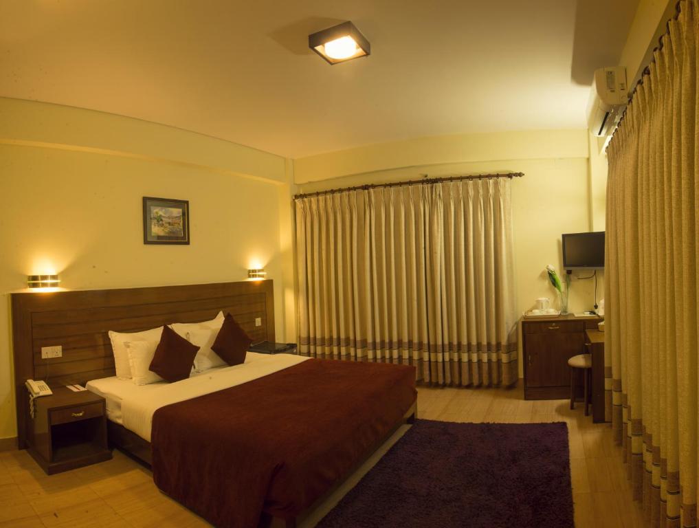 Ein Bett oder Betten in einem Zimmer der Unterkunft Hotel Tara