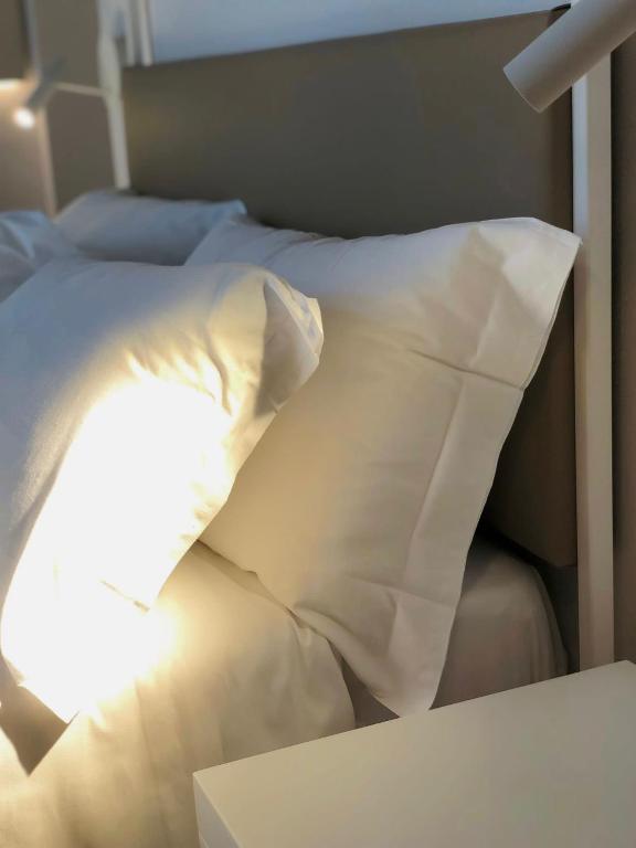 Postel nebo postele na pokoji v ubytování Hotel Saraceno Al Faro