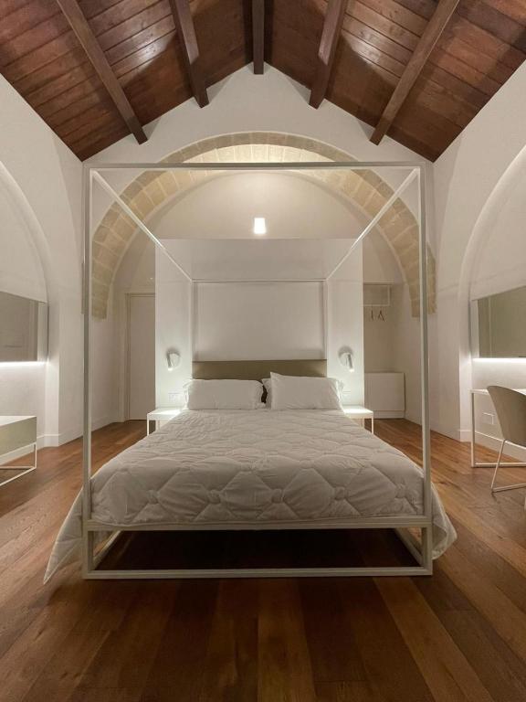 Postel nebo postele na pokoji v ubytování Hotel Saraceno Al Faro