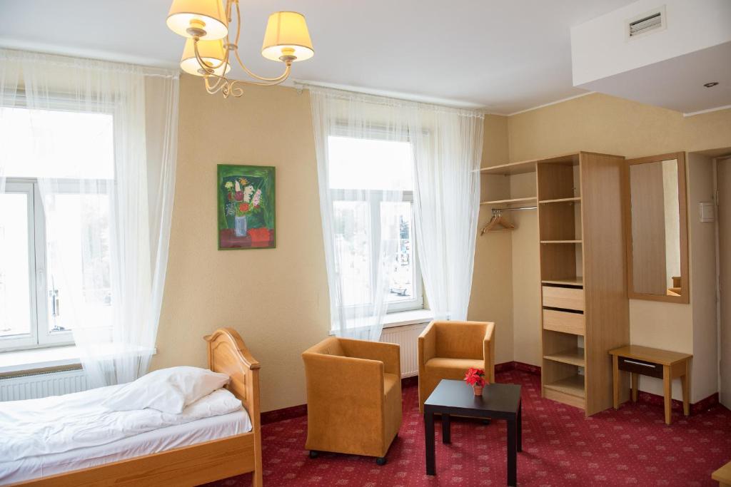 Postel nebo postele na pokoji v ubytování Alexa Old Town