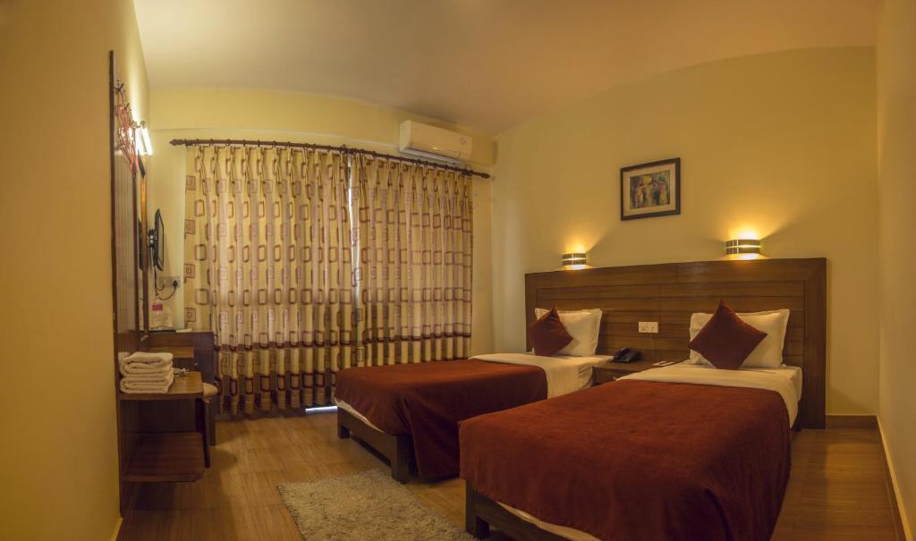 Ein Bett oder Betten in einem Zimmer der Unterkunft Hotel Tara