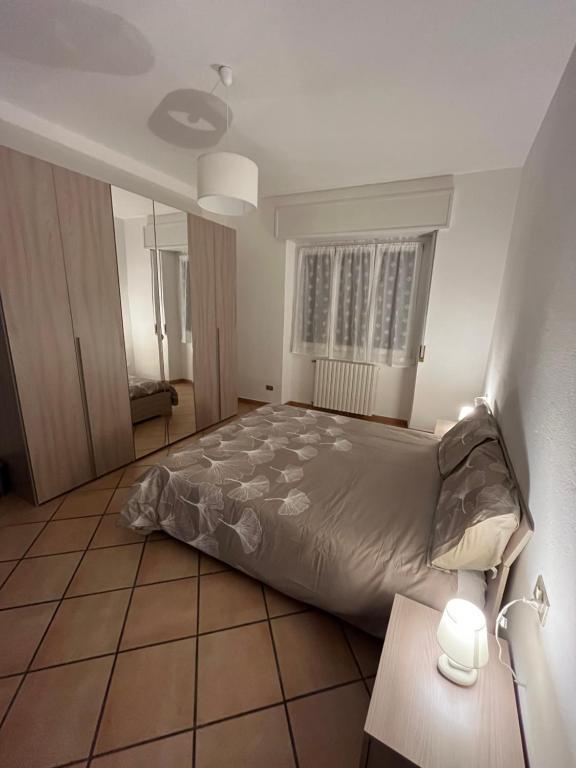 Postel nebo postele na pokoji v ubytování Casa vacanze due laghi