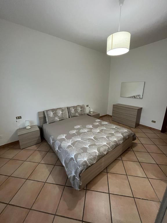 Postel nebo postele na pokoji v ubytování Casa vacanze due laghi