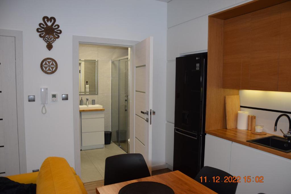 Kuchyň nebo kuchyňský kout v ubytování Apartament Spokojny