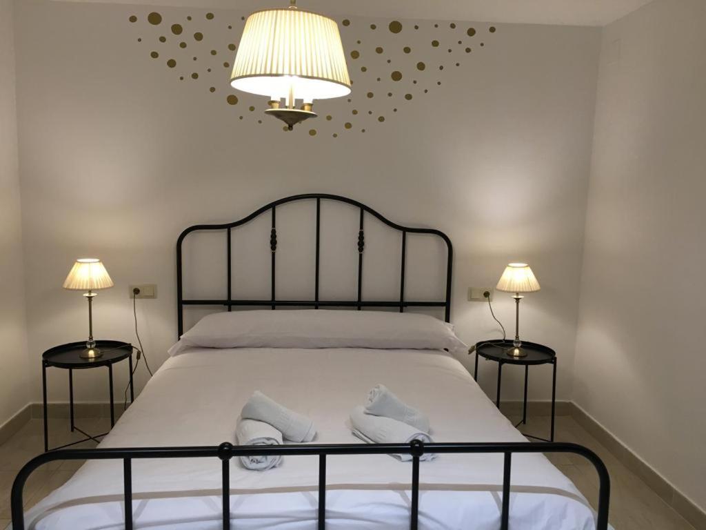 Postel nebo postele na pokoji v ubytování Apartamento Avenida