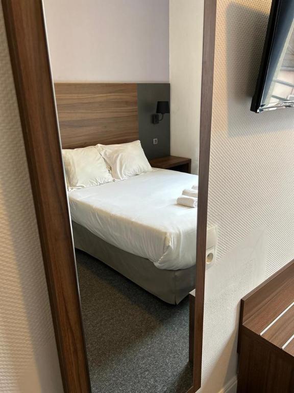 Postel nebo postele na pokoji v ubytování Hotel Moderne