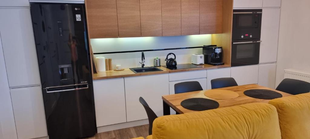 Kuchyň nebo kuchyňský kout v ubytování Apartament Spokojny