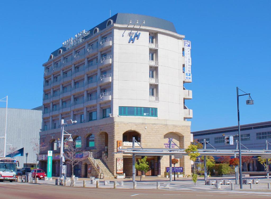 a building on a city street with at Hyper Hotel Komatsu in Komatsu