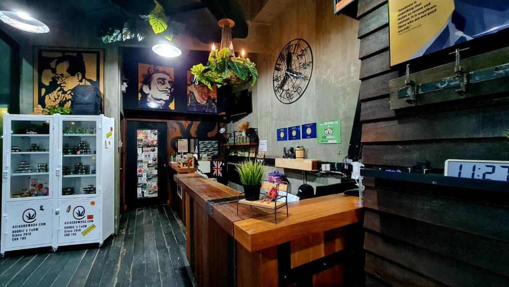 A compact restaurant counter and service area with a strong industrial-art style.