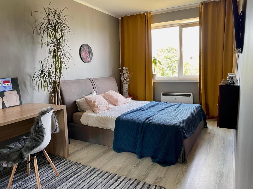 A bed or beds in a room at Милая квартира в 7 км от Таллинна