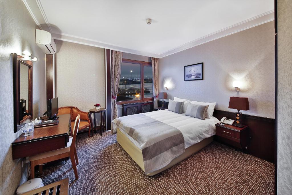 Postel nebo postele na pokoji v ubytování Sidonya Hotel