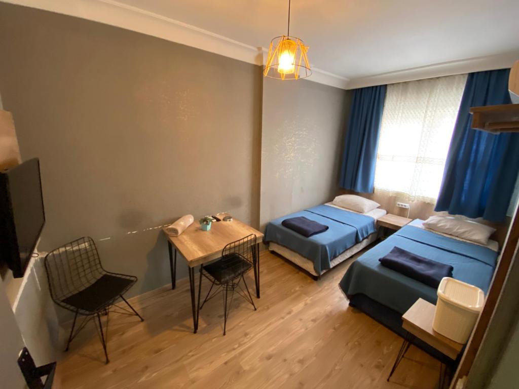 Postel nebo postele na pokoji v ubytování Köşk Hotel