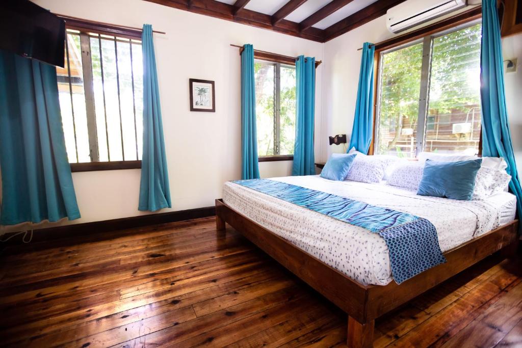 Postel nebo postele na pokoji v ubytování Mango Inn Resort