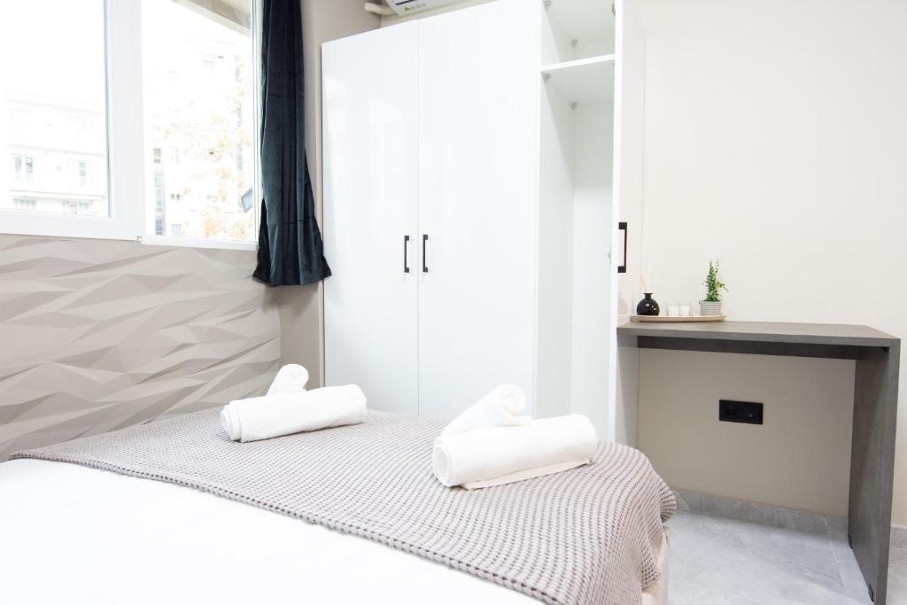 Posteľ alebo postele v izbe v ubytovaní SKG Luxury Apartment