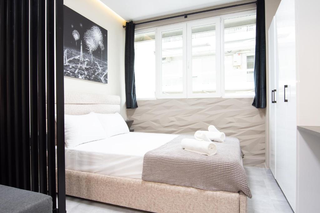 Posteľ alebo postele v izbe v ubytovaní SKG Luxury Apartment
