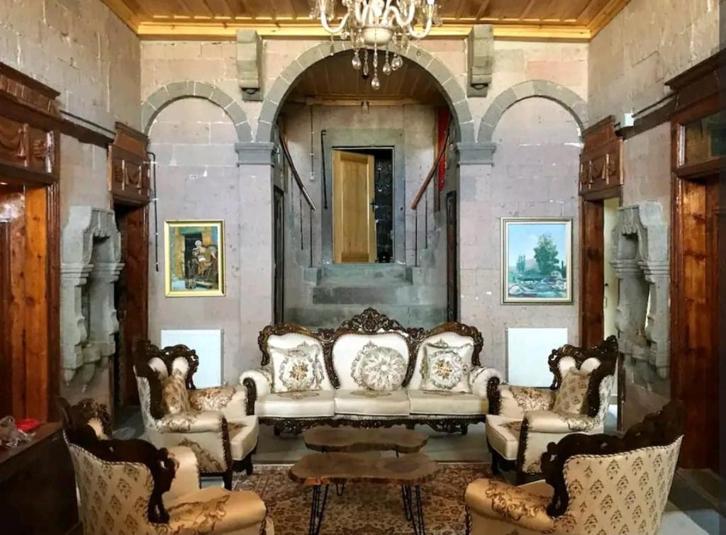 a living room with a couch and chairs at Eshel Mansion Near Cappadocia And Erciyes in Talas