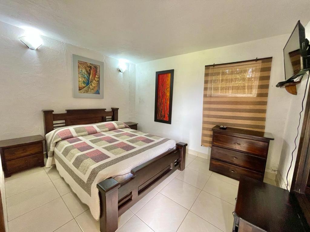 Postel nebo postele na pokoji v ubytování Finca Hotel La Ponderosa