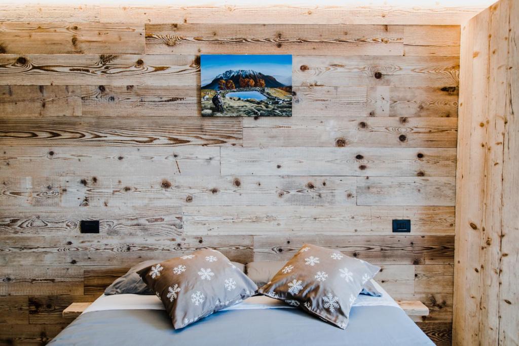 Postel nebo postele na pokoji v ubytování Atelier della Montagna