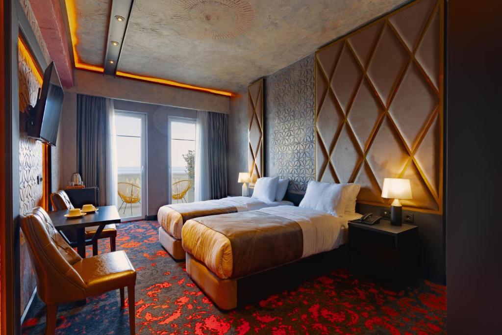 Postel nebo postele na pokoji v ubytování Tapis Rouge Design Boutique Hotel