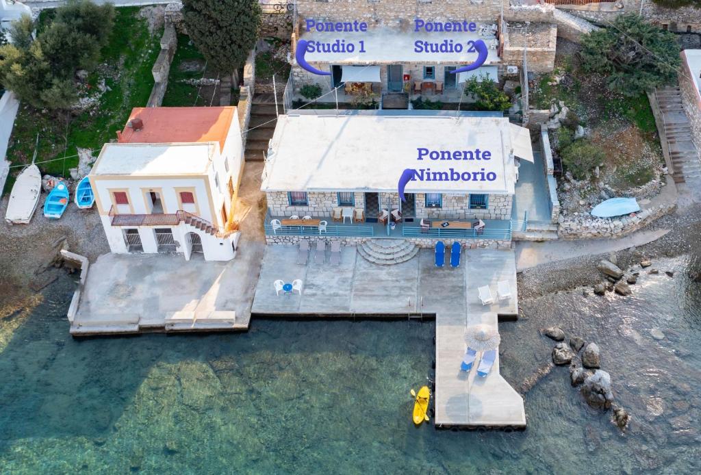 an aerial view of a building with a swimming pool at Ponente in Symi