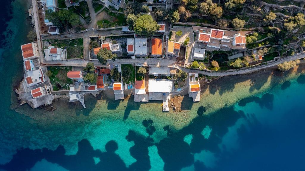 an aerial view of a house on a island in the water at Ponente in Symi