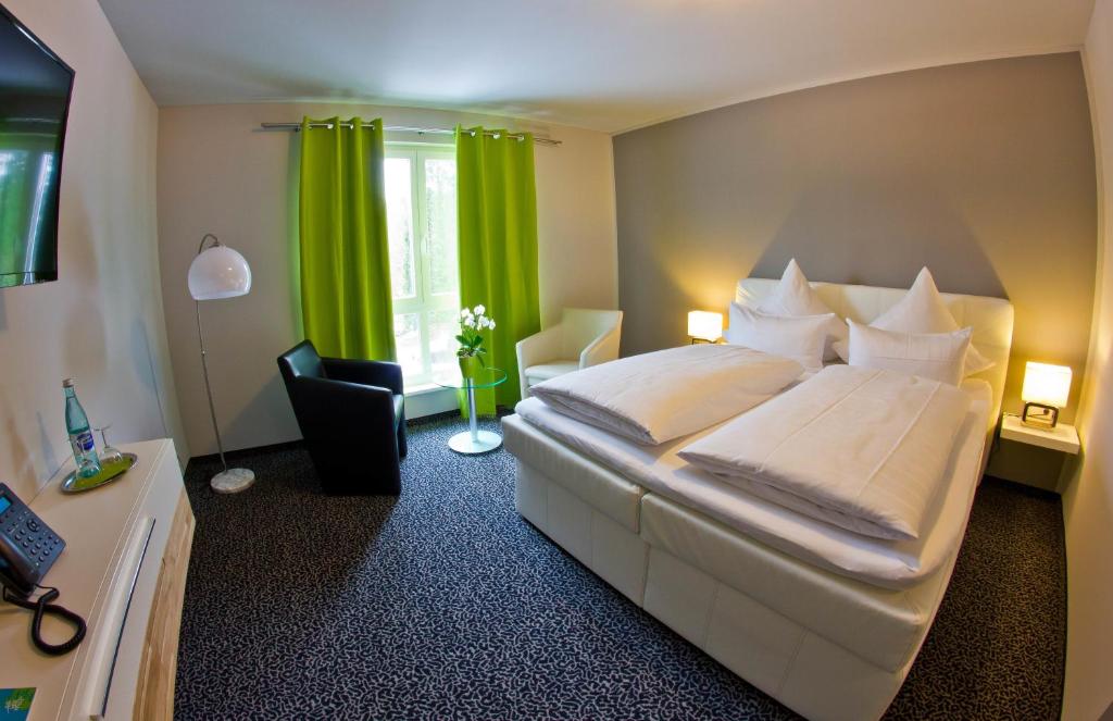 Postel nebo postele na pokoji v ubytování Hotel Eyberg