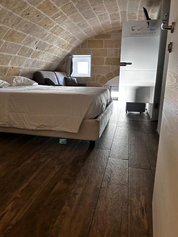 Postel nebo postele na pokoji v ubytování Recinto antico Sweet Rooms