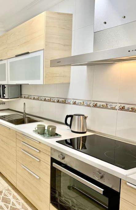 Kuchyň nebo kuchyňský kout v ubytování Confortable apartamento en pueblo costero
